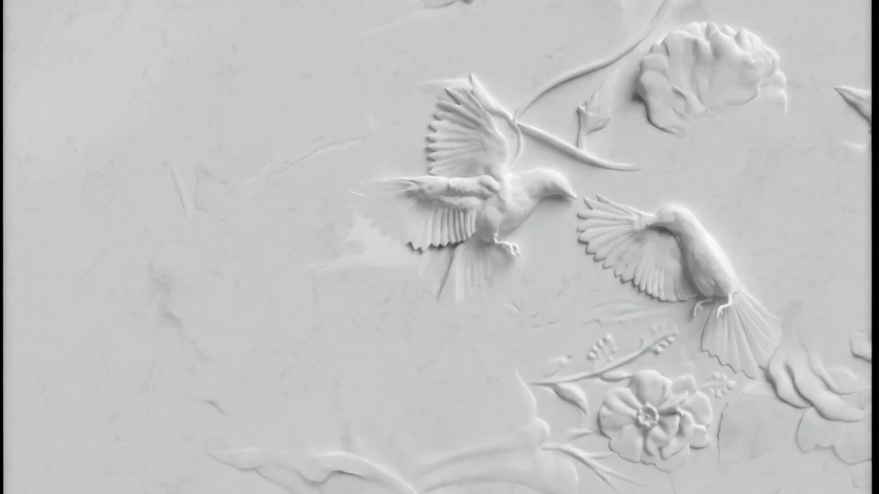 Bas-relief sculpture of birds and flowers in cream plaster